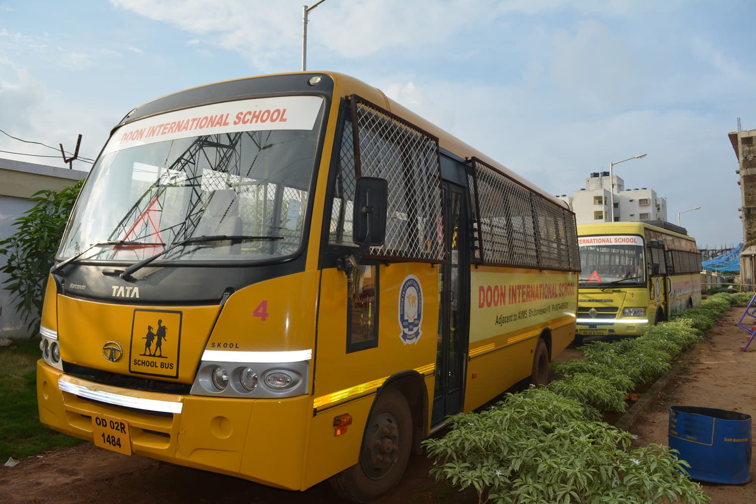 Driver and escort attending to students boarding the bus